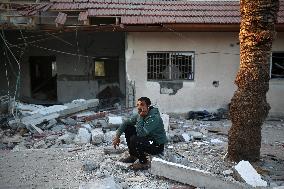 In Deir al-Balah People Search Through The Rubble Of Destroyed Homes