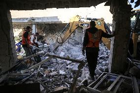 In Deir al-Balah People Search Through The Rubble Of Destroyed Homes