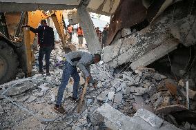 In Deir al-Balah People Search Through The Rubble Of Destroyed Homes