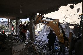 In Deir al-Balah People Search Through The Rubble Of Destroyed Homes