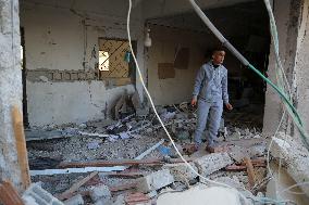 In Deir al-Balah People Search Through The Rubble Of Destroyed Homes