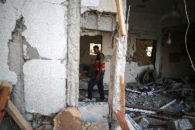 In Deir al-Balah People Search Through The Rubble Of Destroyed Homes