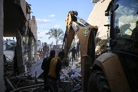 In Deir al-Balah People Search Through The Rubble Of Destroyed Homes