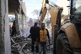 In Deir al-Balah People Search Through The Rubble Of Destroyed Homes