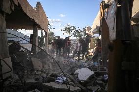 In Deir al-Balah People Search Through The Rubble Of Destroyed Homes