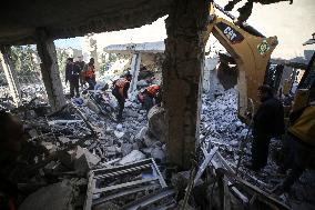 In Deir al-Balah People Search Through The Rubble Of Destroyed Homes