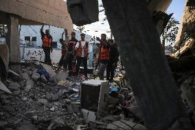 In Deir al-Balah People Search Through The Rubble Of Destroyed Homes