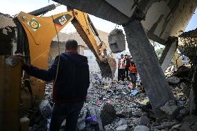 In Deir al-Balah People Search Through The Rubble Of Destroyed Homes