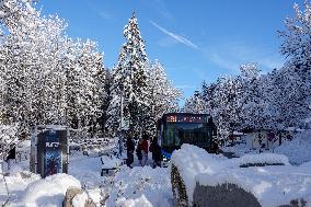 Winter Travelers In Bavaria At Lake Eibsee Bus Stop