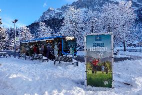 Winter Travelers In Bavaria At Lake Eibsee Bus Stop