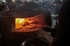 Palestinians Bake Bread - Gaza