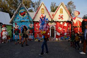 Residents Of Tláhuac, Mexico City, Visit Christmas Village