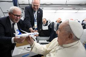 Pope Francis On Flight From Ajaccio To Rome