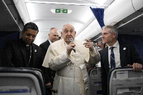 Pope Francis On Flight From Ajaccio To Rome