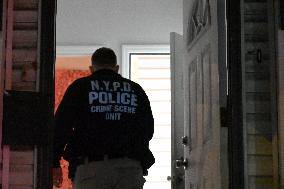 NYPD Crime Scene Investigators At Scene Of 32-year-old Woman Dead And A 49-year-old Man Wounded In A Shooting Inside Of A Buildi