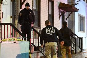 NYPD Crime Scene Investigators At Scene Of 32-year-old Woman Dead And A 49-year-old Man Wounded In A Shooting Inside Of A Buildi