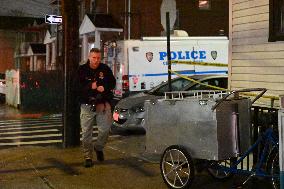 NYPD Crime Scene Investigators At Scene Of 32-year-old Woman Dead And A 49-year-old Man Wounded In A Shooting Inside Of A Buildi