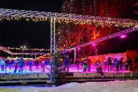 Ice Skating Under Festive Lights