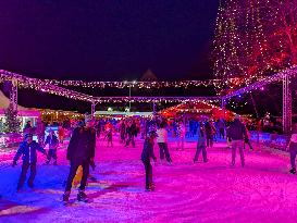 Ice Skating Under Festive Lights