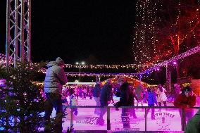 Ice Skating Under Festive Lights