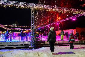 Ice Skating Under Festive Lights