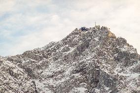 People Hiking Around The Bavarian Alpine Lake Eibsee In Winter