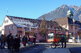 Travelers At Bus Stop At Garmisch-Partenkirchen Train Station