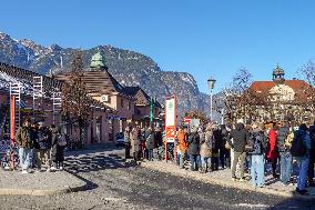 Travelers At Bus Stop At Garmisch-Partenkirchen Train Station