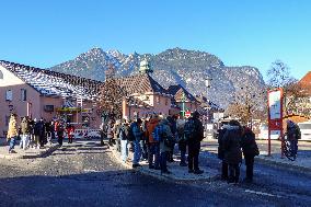 Travelers At Bus Stop At Garmisch-Partenkirchen Train Station