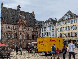 DHL Delivery Van At The Historic Marketplace Of Marburg