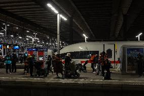 Travelers At Munich Central Station During The Temporary Suspension Of Train Services