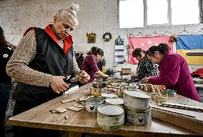 Volunteers make trench candles for soldiers in Zaporizhzhia