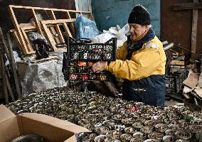 Volunteers make trench candles for soldiers in Zaporizhzhia