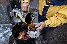 Volunteers make trench candles for soldiers in Zaporizhzhia