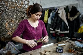 Volunteers make trench candles for soldiers in Zaporizhzhia