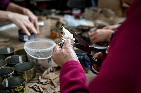 Volunteers make trench candles for soldiers in Zaporizhzhia