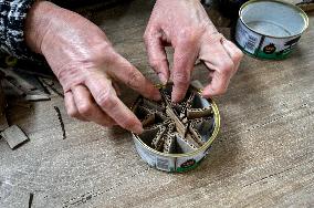 Volunteers make trench candles for soldiers in Zaporizhzhia