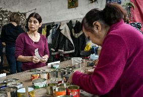 Volunteers make trench candles for soldiers in Zaporizhzhia