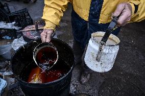 Volunteers make trench candles for soldiers in Zaporizhzhia