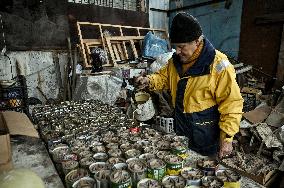 Volunteers make trench candles for soldiers in Zaporizhzhia