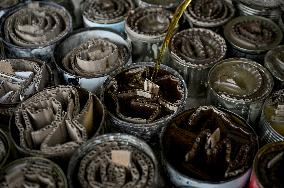 Volunteers make trench candles for soldiers in Zaporizhzhia