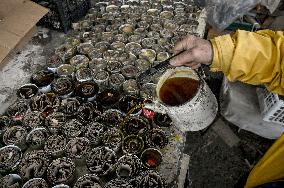 Volunteers make trench candles for soldiers in Zaporizhzhia