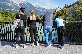 People Admiring The Inn River In Innsbruck