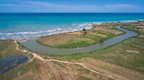 River Meets The Sea: Ofanto River Estuary From Above