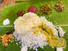 Traditional Sadya Meal Is Served On A Banana Leaf