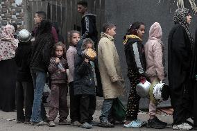 Palestinians Receive Food Amid Food Crisis - Gaza