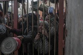 Palestinians Receive Food Amid Food Crisis - Gaza