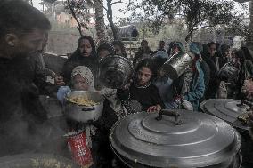 Palestinians Receive Food Amid Food Crisis - Gaza