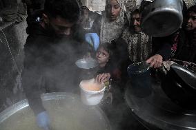 Palestinians Receive Food Amid Food Crisis - Gaza