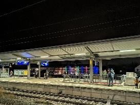 Passengers Waiting During Sleet At A Train Station On Munich